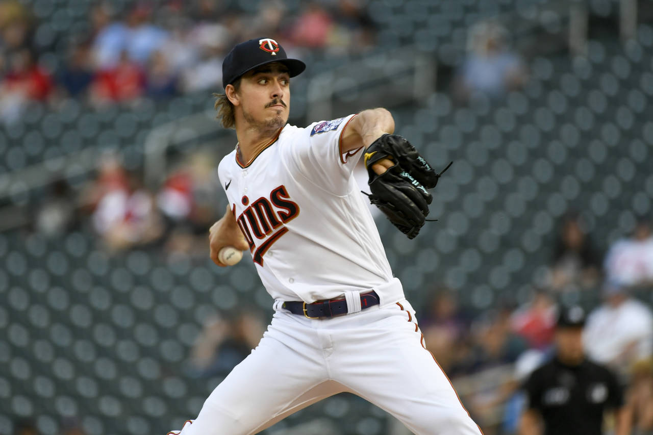 Minnesota Twins pitcher Joe Ryan throws against the Houston Astros during the first inning of a bas...