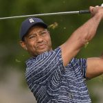 
              Tiger Woods watches his tee shot on the 11th hole during the first round of the PGA Championship golf tournament, Thursday, May 19, 2022, in Tulsa, Okla. (AP Photo/Matt York)
            