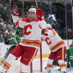 
              Calgary Flames defenseman Michael Stone reacts after scoring a goal against the Dallas Stars during the second period of Game 6 of an NHL hockey Stanley Cup first-round playoff series, Friday, May 13, 2022, in Dallas. (AP Photo/Tony Gutierrez)
            