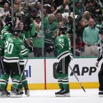 
              Dallas Stars players celebrate a goal by Miro Heiskanen during the second period of Game 6 of an NHL hockey Stanley Cup first-round playoff series against the Calgary Flames, Friday, May 13, 2022, in Dallas. (AP Photo/Tony Gutierrez)
            
