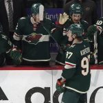 
              Minnesota Wild's Kirill Kaprizov (97) is greeted at the bench after he scored his third goal of the night against the St. Louis Blues, during the third period of Game 2 of an NHL hockey Stanley Cup first-round playoff series Wednesday, May 4, 2022, in St. Paul, Minn. The Wild won 6-2. (AP Photo/Jim Mone)
            