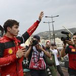 
              Ferrari driver Charles Leclerc of Monaco celebrates after setting the pole position in the qualifying session at the Monaco racetrack, in Monaco, Saturday, May 28, 2022. The Formula one race will be held on Sunday. (Pool Photo/Christian Bruna/Via AP)
            