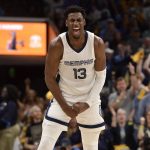 
              Memphis Grizzlies forward Jaren Jackson Jr. (13) reacts after scoring a 3-point basket in the second half during Game 1 of a second-round NBA basketball playoff series against the Golden State Warriors, Sunday, May 1, 2022, in Memphis, Tenn. (AP Photo/Brandon Dill)
            