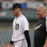 
              Detroit Tigers starting pitcher Joey Wentz, walks to the dugout with athletic trainer Doug Teter in the fifth inning of the second baseball game of a doubleheader against the Minnesota Twins, Tuesday, May 31, 2022, in Detroit. (AP Photo/Carlos Osorio)
            