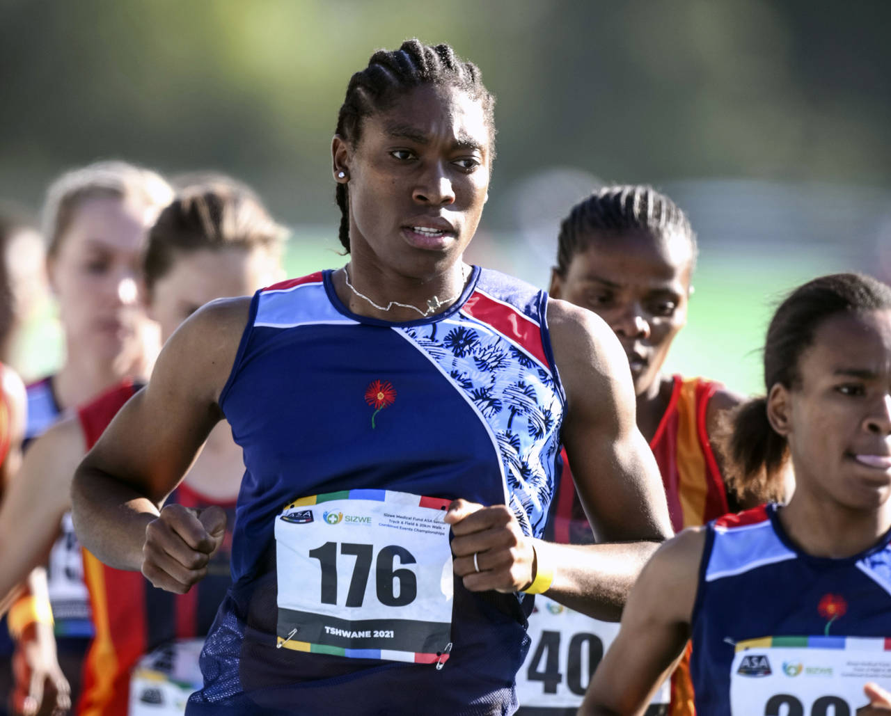 FILE - South African long distance athlete Caster Semenya (176) runs on her way to winning the 5,00...