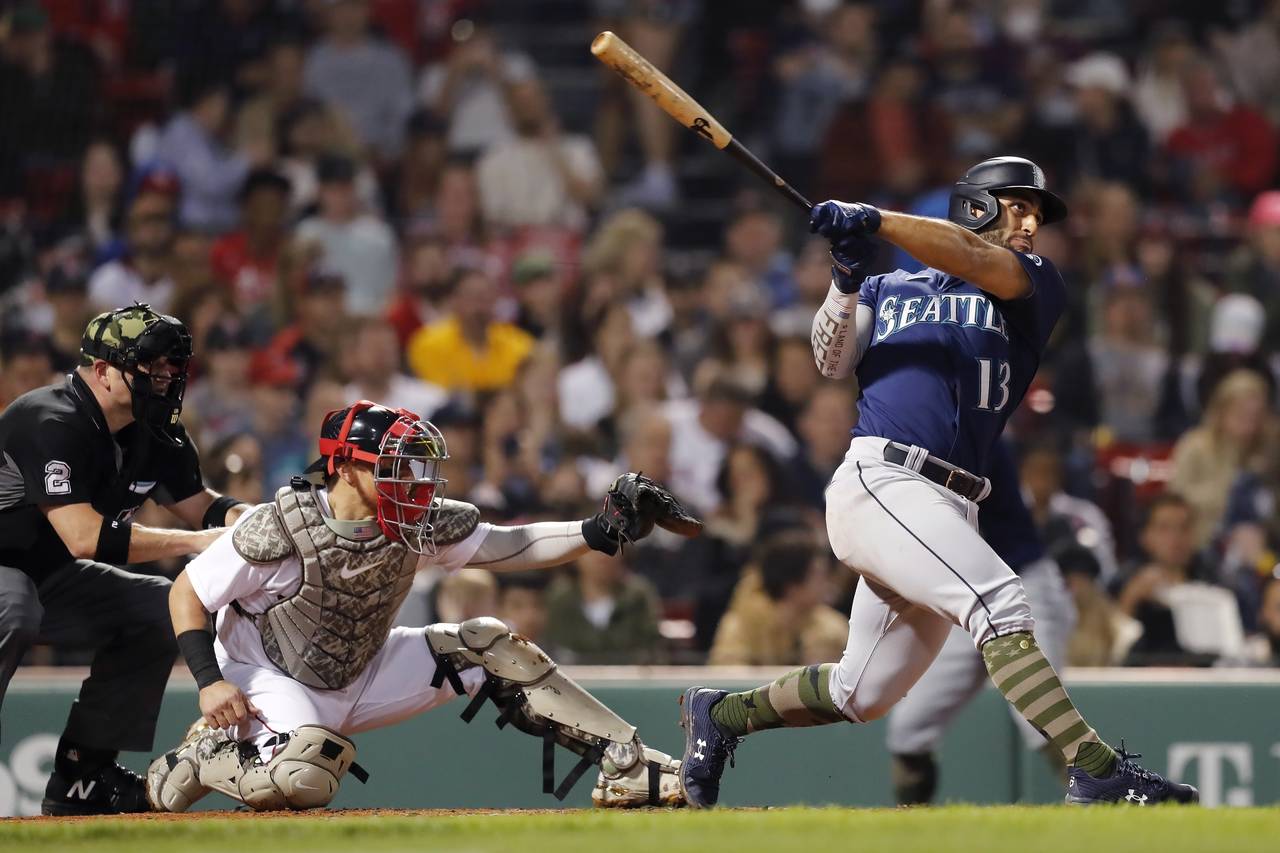 Seattle Mariners' Abraham Toro (13) follow through on this two-run home run in front of Boston Red ...