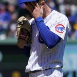 
              Chicago Cubs starting pitcher Drew Smyly wipes his face during the first inning in the first baseball game of a doubleheader against the Los Angeles Dodgers, Saturday, May 7, 2022, in Chicago. (AP Photo/Nam Y. Huh)
            