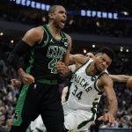 
              Boston Celtics' Al Horford reacts in front of Milwaukee Bucks' Giannis Antetokounmpo during the second half of Game 4 of an NBA basketball Eastern Conference semifinals playoff series Monday, May 9, 2022, in Milwaukee. The Celtics won 116-108 to tie the series 2-2. (AP Photo/Morry Gash)
            