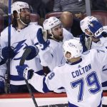 
              Tampa Bay Lightning center Ross Colton (79) is congratulated after scoring agains the Florida Panthers in the closing seconds of Game 2 of an NHL hockey second-round playoff series Thursday, May 19, 2022, in Sunrise, Fla. (AP Photo/Reinhold Matay)
            