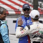 
              Jimmie Johnson, middle, talks with Juan Pablo Montoya, left, of Colombia, and Santino Ferrucci before practice for the Indianapolis 500 auto race at Indianapolis Motor Speedway, Monday, May 23, 2022, in Indianapolis. (AP Photo/Darron Cummings)
            