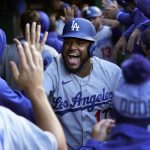 
              Los Angeles Dodgers' Hanser Alberto (17) celebrates in the dugout after scoring against the Chicago Cubs during the second inning in the second baseball game of a doubleheader Saturday, May 7, 2022, in Chicago. (AP Photo/Charles Rex Arbogast)
            