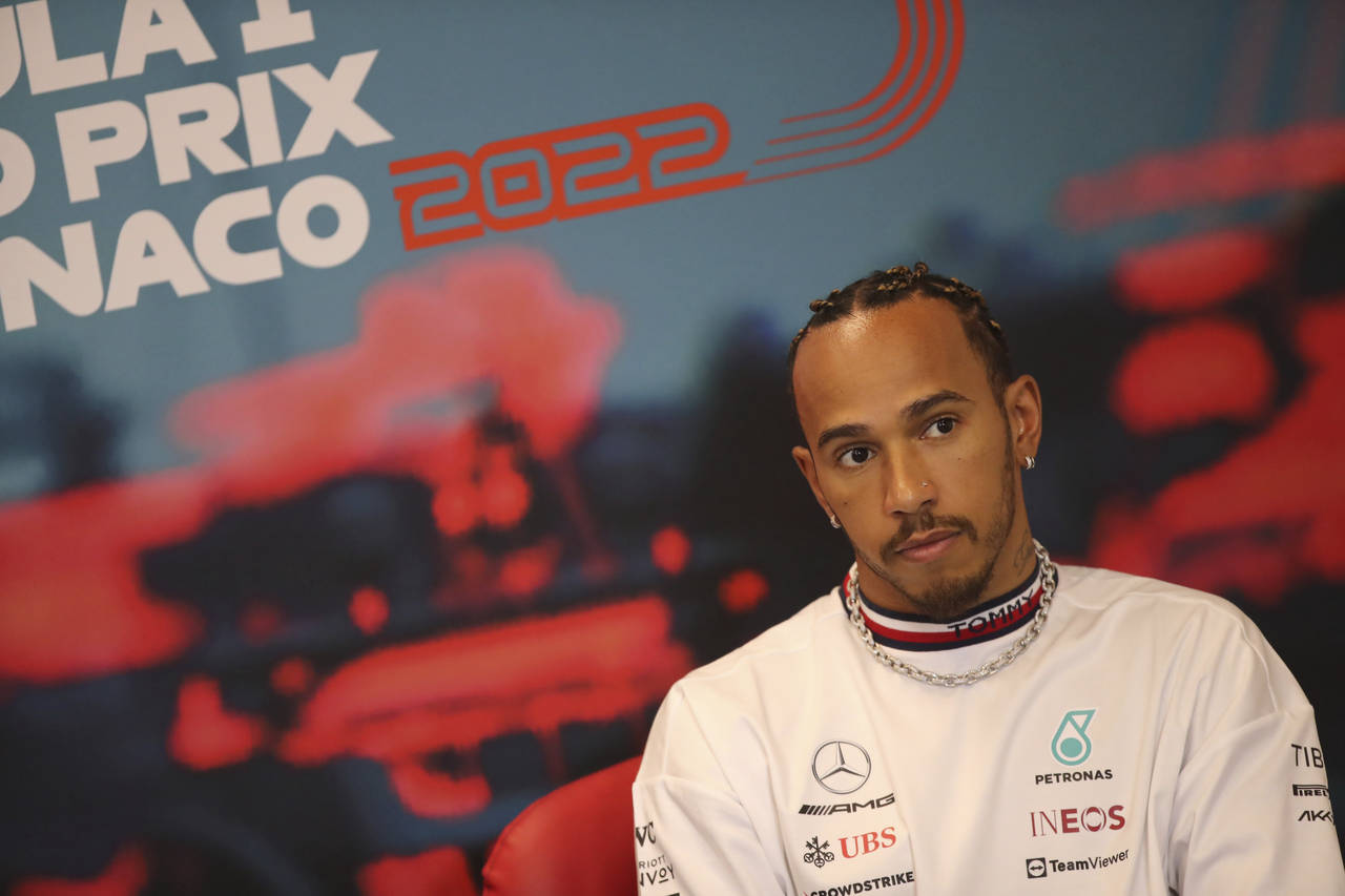 Mercedes driver Lewis Hamilton of Britain answers to reporters during a news conference ahead the f...