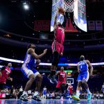 
              Miami Heat's Jimmy Butler dunks against Philadelphia 76ers' Tyrese Maxey (0) and James Harden (1) during the second half of Game 6 of an NBA basketball second-round playoff series, Thursday, May 12, 2022, in Philadelphia. (AP Photo/Matt Slocum)
            
