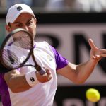 
              Aslan Karatsev returns the ball to Novak Djokovic during their match at the Italian Open tennis tournament, in Rome, Tuesday, May 10, 2022. (AP Photo/Andrew Medichini)
            