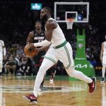 
              Boston Celtics guard Jaylen Brown (7) drives to the basket against the Miami Heat during the second half of Game 4 of the NBA basketball playoffs Eastern Conference finals, Monday, May 23, 2022, in Boston. (AP Photo/Charles Krupa)
            