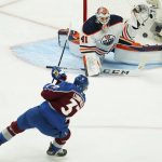 
              Colorado Avalanche left wing J.T. Compher (37) scores a goal against Edmonton Oilers goaltender Mike Smith (41) during the first period in Game 1 of the NHL hockey Stanley Cup playoffs Western Conference finals Tuesday, May 31, 2022, in Denver. (AP Photo/Jack Dempsey)
            