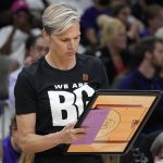 
              New Phoenix Mercury head coach Vanessa Nygaard wears a T-shirt referring to player Brittney Griner before a WNBA basketball game against the Las Vegas Aces, Friday, May 6, 2022, in Phoenix. Griner has been detained in Russia since Feb. 17 after authorities at the Moscow airport said they found vape cartridges that allegedly contained oil derived from cannabis in her luggage. (AP Photo/Darryl Webb)
            