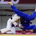 
              FILE - Somon Makhmadbekov, of Tajikistan, left, and Ahmad Alikaj, of the Refugee Olympic Team, compete during their men's 73kg elimination round of the judo match, at the 2020 Summer Olympics in Tokyo, Japan, Monday, July 26, 2021. The Olympic Refugee Foundation and the refugee Olympics team are the winners of this year’s Princess of Asturias Award for sports, the Spanish foundation that organizes the prizes said Wednesday, May 25, 2022. (AP Photo/Vincent Thian, File)
            
