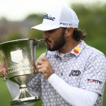 
              Max Homa kisses the trophy after winning the Wells Fargo Championship golf tournament, Sunday, May 8, 2022, at TPC Potomac at Avenel Farm golf club in Potomac, Md. (AP Photo/Nick Wass)
            