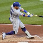 
              Los Angeles Dodgers' Justin Turner doubles off Pittsburgh Pirates starting pitcher Bryse Wilson, driving in two runs, during the third inning of a baseball game in Pittsburgh, Tuesday, May 10, 2022. (AP Photo/Gene J. Puskar)
            