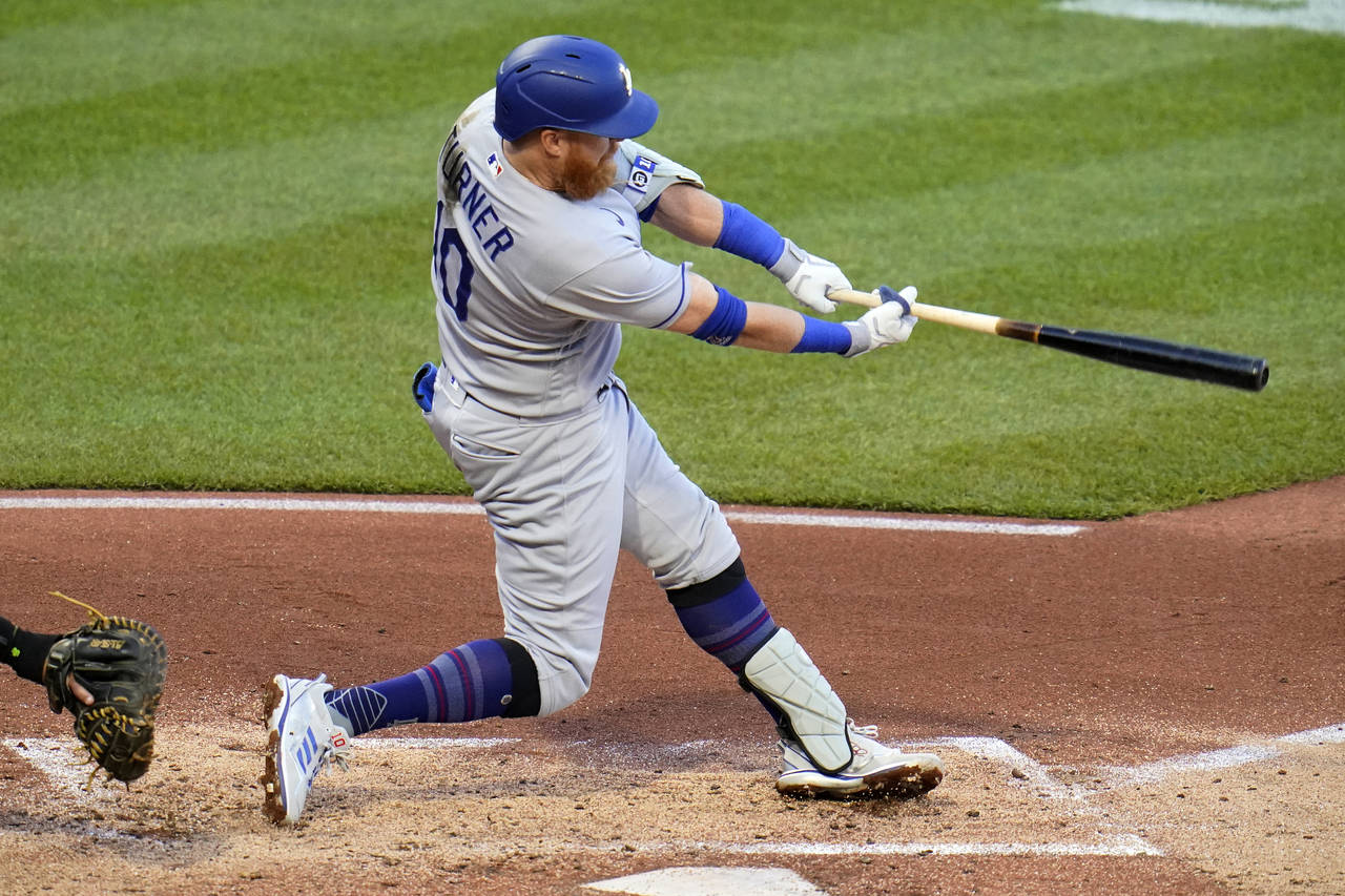 Los Angeles Dodgers' Justin Turner doubles off Pittsburgh Pirates starting pitcher Bryse Wilson, dr...