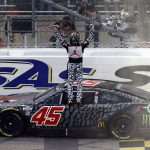 
              Kurt Busch celebrates after winning a NASCAR Cup Series auto race at Kansas Speedway in Kansas City, Kan., Sunday, May 15, 2022. (AP Photo/Colin E. Braley)
            