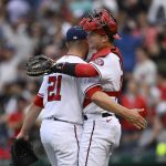 
              Washington Nationals catcher Riley Adams, right, and relief pitcher Tanner Rainey (21) celebrate after the team's baseball game against the Los Angeles Dodgers, Wednesday, May 25, 2022, in Washington. The Nationals won 1-0. (AP Photo/Nick Wass)
            