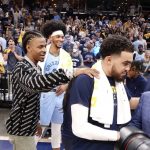 
              Memphis Grizzlies' Ja Morant, left, congratulates teammate Tyus Jones after the second half of Game 5 of an NBA basketball second-round playoff series against the Golden State Warriors' Wednesday, May 11, 2022, in Memphis, Tenn. (AP Photo/Karen Pulfer Focht)
            