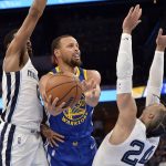 
              Golden State Warriors guard Stephen Curry (30) shoots against Memphis Grizzlies forward Dillon Brooks (24) and guard De'Anthony Melton (0) in the second half during Game 1 of a second-round NBA basketball playoff series Sunday, May 1, 2022, in Memphis, Tenn. (AP Photo/Brandon Dill)
            