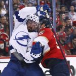 
              Florida Panthers center Noel Acciari, right, knocks Tampa Bay Lightning left wing Nicholas Paul (20) off the puck during the first period of Game 2 of an NHL hockey second-round playoff series Thursday, May 19, 2022, in Sunrise, Fla. (AP Photo/Reinhold Matay)
            