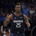 
              Dallas Mavericks forward Reggie Bullock (25) reacts after scoring against the Phoenix Suns during the second half of Game 6 of an NBA basketball second-round playoff series, Thursday, May 12, 2022, in Dallas. (AP Photo/Tony Gutierrez)
            