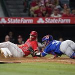 
              Los Angeles Angels' Mike Trout (27) is tagged out at home by Toronto Blue Jays catcher Alejandro Kirk (30) during the fifth inning of a baseball game in Anaheim, Calif., Friday, May 27, 2022. (AP Photo/Ashley Landis)
            