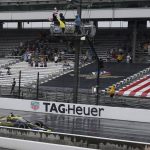 
              Colton Herta takes the checkered flag to win the IndyCar Grand Prix auto race at Indianapolis Motor Speedway, Saturday, May 14, 2022, in Indianapolis. (AP Photo/Darron Cummings)
            