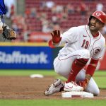 
              Cincinnati Reds' Joey Votto gestures for a timeout after hitting a two-run triple against the Chicago Cubs during the third inning of a baseball game in Cincinnati, Wednesday, May 25, 2022. (AP Photo/Aaron Doster)
            