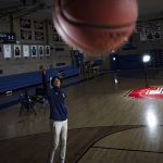 
              Johnuel "Boogie" Fland shoots hoops in the gymnasium of Archbishop Stepinac High School in White Plains, N.Y., Monday, May 2, 2022. Fland is among a growing number of high school athletes who have signed sponsorship deals for their name, image and likeness following a Supreme Court decision last year that allowed similar deals for college athletes. (AP Photo/Robert Bumsted)
            