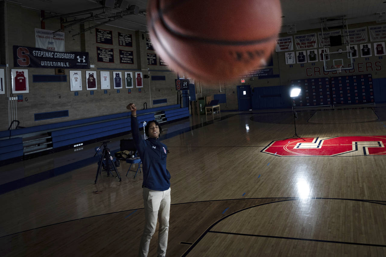 Johnuel "Boogie" Fland shoots hoops in the gymnasium of Archbishop Stepinac High School in White Pl...