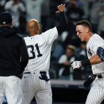 
              New York Yankees' Aaron Judge celebrates with teammates at home plate after hitting a walk-off three-run home run during the ninth inning of a baseball game against the Toronto Blue Jays Tuesday, May 10, 2022, in New York. The Yankees won 6-5. (AP Photo/Frank Franklin II)
            