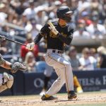 
              iPittsburgh Pirates' Tucupita Marcano hits a single against the San Diego Padres during the third inning of a baseball game Sunday, May 29, 2022, in San Diego. (AP Photo/Mike McGinnis)
            