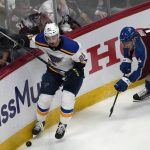 
              St. Louis Blues center Tyler Bozak, left, collects the puck as Colorado Avalanche defenseman Bowen Byram pursues in overtime of Game 5 of an NHL hockey Stanley Cup second-round playoff series Wednesday, May 25, 2022, in Denver. (AP Photo/David Zalubowski)
            
