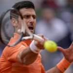 
              Serbia's Novak Djokovic returns the ball against Gael Monfils, of France, during their match at the Mutua Madrid Open tennis tournament in Madrid, Spain, Tuesday, May 3, 2022. (AP Photo/Manu Fernandez)
            