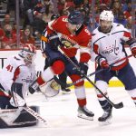 
              Florida Panthers center Sam Bennett (9) jumps to get out of the way of a shot as Washington Capitals goaltender Vitek Vanecek (41) and defenseman Justin Schultz (2) defend during the second period of Game 1 of an NHL hockey first-round playoff series Tuesday, May 3, 2022, in Sunrise, Fla. (AP Photo/Reinhold Matay)
            