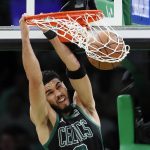 
              Boston Celtics' Jayson Tatum dunks against the Miami Heat during the first half of Game 6 of the NBA basketball playoffs Eastern Conference finals Friday, May 27, 2022, in Boston. (AP Photo/Michael Dwyer)
            