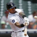 
              Detroit Tigers' Javier Baez hits a double against the Minnesota Twins in the fourth inning of the first game of a baseball doubleheader in Detroit, Tuesday, May 31, 2022. (AP Photo/Paul Sancya)
            