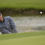 
              Rory McIlroy, of Northern Ireland, hits from the bunker on the 13th hole during the third round of the PGA Championship golf tournament at Southern Hills Country Club, Saturday, May 21, 2022, in Tulsa, Okla. (AP Photo/Matt York)
            