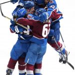 
              Colorado Avalanche defenseman Josh Manson (42) is congratulated by Samuel Girard (49), Artturi Lehkonen (62) and Gabriel Landeskog (92) after scoring in overtime against the St. Louis Blues in Game 1 of an NHL hockey Stanley Cup second-round playoff series Tuesday, May 17, 2022, in Denver. The Avalanche won 3-2. (AP Photo/Jack Dempsey)
            