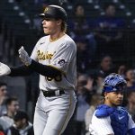 
              Pittsburgh Pirates' Jack Suwinski, left, celebrates after hitting a solo home run as Chicago Cubs catcher Willson Contreras looks to the field during the fifth inning of a baseball game in Chicago, Wednesday, May 18, 2022. (AP Photo/Nam Y. Huh)
            