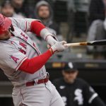 
              Los Angeles Angels' Mike Trout hits a solo home run during the first inning of a baseball game against the Chicago White Sox in Chicago, Sunday, May 1, 2022. (AP Photo/Nam Y. Huh)
            