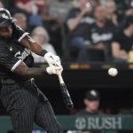 
              Chicago White Sox's Tim Anderson hits an RBI double off Cleveland Guardians starting pitcher Zach Plesac during the seventh inning of a baseball game Monday, May 9, 2022, in Chicago. Leury Garcia scored on the play. (AP Photo/Charles Rex Arbogast)
            