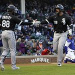 
              Chicago White Sox's Jose Abreu (79) celebrates his home run off Chicago Cubs starting pitcher Kyle Hendricks with Luis Robert during the first inning of a baseball game Wednesday, May 4, 2022, in Chicago. (AP Photo/Charles Rex Arbogast)
            