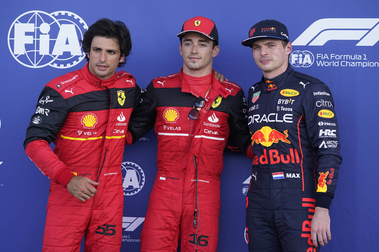 From left, second place Ferrari driver Carlos Sainz of Spain, pole position starter Ferrari driver ...